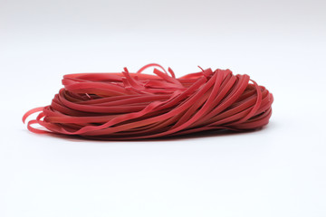 Isolated red spaghetti nest on a white background