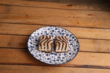 small chocolate cakes in color background