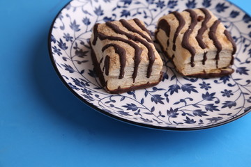 small chocolate cakes in color background