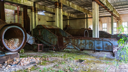 Abandoned workshop in the resettlement zone in Polessky radiation-ecological reserve in the village of Babichi. Ecological concept.