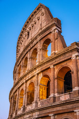Rome, Italy - External walls of the ancient roman Colosseum - Colosseo - known also as Flavian amphitheater - Anfiteatro Flavio - in an evening light