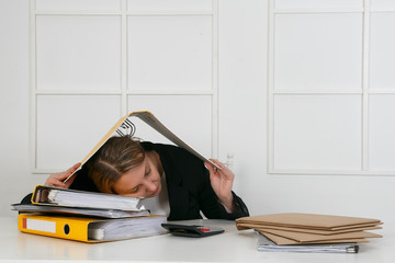 picture of woman sleeping at work in funny pose