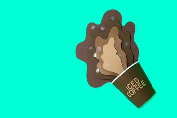 Paper cup with spilled iced coffee