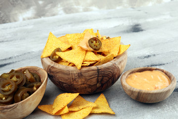 Homemade Nachos with Cheddar Cheese and Jalapenos. Mexican tortilla chips with sauce