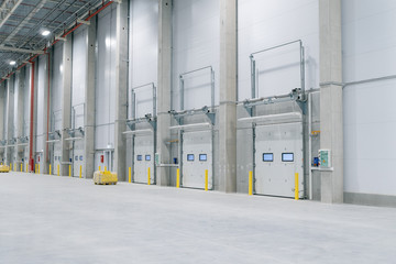 gate in Large modern empty storehouse, nobody