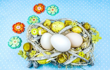 Easter eggs . feast of religion .  Chicken eggs in a nest