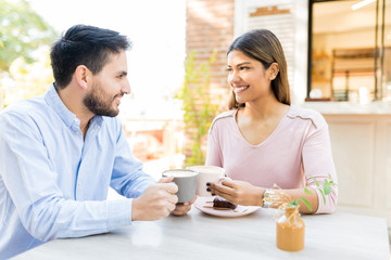 Obraz na płótnie Canvas Hispanic Couple Having Coffee During Date