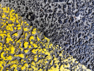 Texture of black and yellow asphalt for design, background or wallpaper.