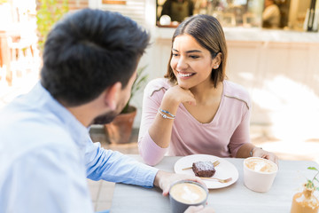 Latin Couple Is Having Coffee During Date