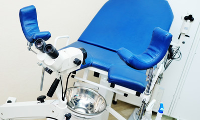 doctor's office for women's health-gynecological microscope and chair close-up.