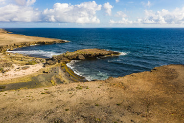 Aerial view of coast of Curaçao in the Caribbean Sea with turquoise water, cliff, beach and...