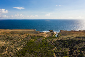 Aerial view of coast of Curaçao in the Caribbean Sea with turquoise water, cliff, beach and...