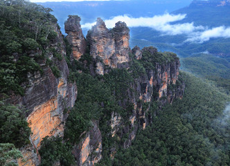 Fototapeta na wymiar Rock Formation Three Sisters In The Foggy Blue Mountains NSW Australia