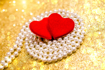 Heart symbol on a gold shiny background