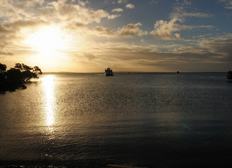 Naklejka na ściany i meble Ship Approaching Fraser Island In The Sunset Light Queensland Australia