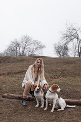 Girl on a walk with dogs in the fall