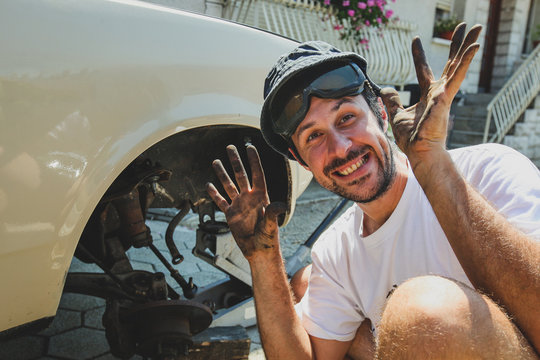 Amateur Mechanic With Dirty Hands.