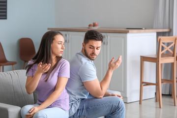 Young couple quarreling at home
