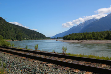 Railroad next to beautiful Skeena River in British Columbia / Canada