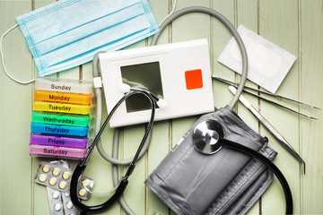 First aid kit on wooden background
