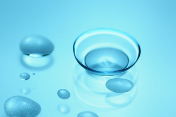 Contact lens on color background