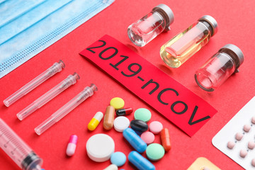 Medicines for Coronavirus on color background