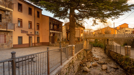Beautiful snowy landscape of Guadarrama mountains in a small medieval town of Rascafria near the Spanish capital Madrid in winter. Famous touristic attraction for winter sports in Madrid, Spain