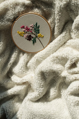 overhead view of blanket and embroidery