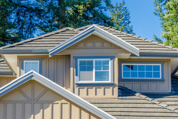 The roof of the house with nice window.