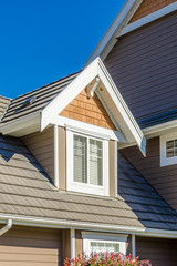 The roof of the house with nice window.