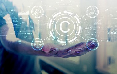 Copyright concept with young man holding his hand