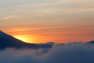 Beautiful sunset between clouds and mountains - landscapes in Guatemala