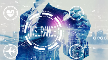 Insurance concept with businessman on a city background
