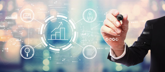 Business growth analysis with businessman on blurred abstract background