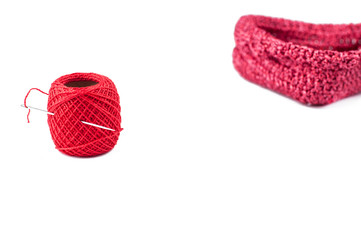Red thread, heart shaped basket  and needle isolated on white background. Copy space.