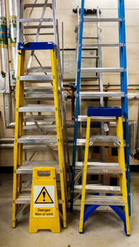 Various sets of ladders in a maintenence workshop