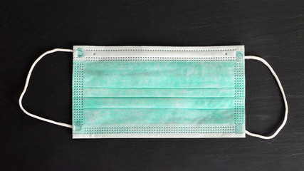 Protective face mask isolated on black background