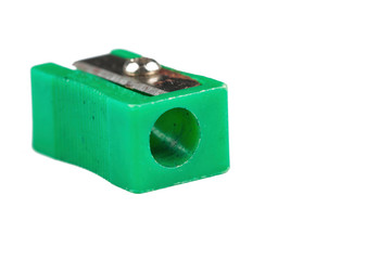 Old green pencil sharpener isolated on white background.Copy space