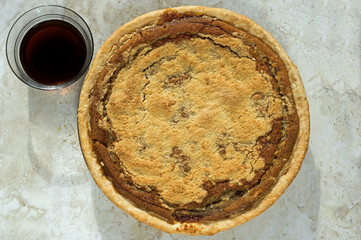 Freshly baked shoofly pie with molasses. Shoofly pie is a molasses pie or cake that developed its...