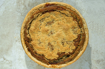 Freshly baked shoofly pie. Shoofly pie is a molasses pie or cake that developed its traditional...