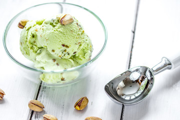 organic homemade ice cream in glass bowl on wooden background