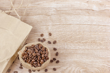 Warm coffee on a wooden plate backgrounds. Vintage backgrounds, Beans backgrounds. Copy space menu.