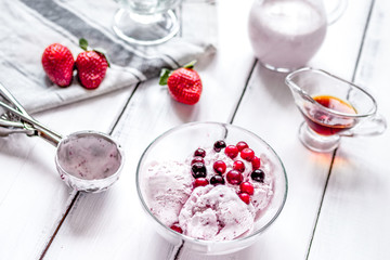 organic homemade ice cream in glass bowl on wooden background