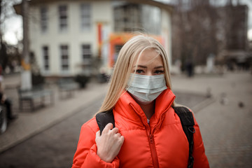 A people wearing a mask on the street. Protection against virus and grip.