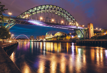 Fototapeta premium The Tyne Bridge over the river Tyne in Newcastle, GATESHEAD at night , ENGLAND. Best seller.