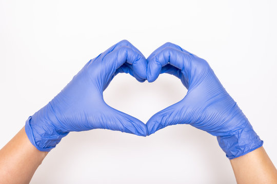 Heart made of latex, nitrile medical gloves for doctor and nurse protection on white background
