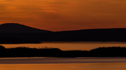 landscape of a sunset. Lake Manicouagan in Quebec. Mountain landscape with lake