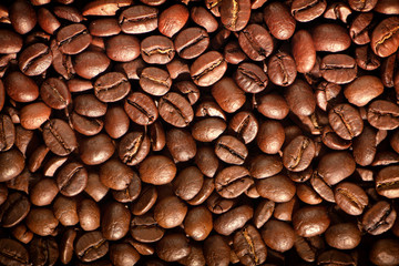 Coffee seeds, texture, natural organic dark background.