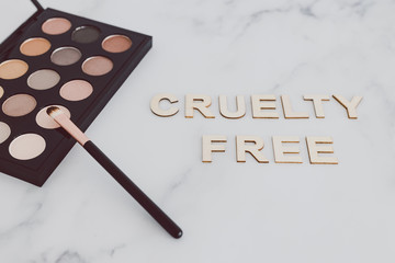 beauty industry and vegan products, make-up brushes and eyeshadow palette with Cruelty free text...