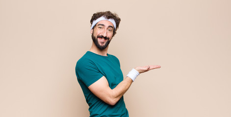 young sports man expressing a concept against flat wall